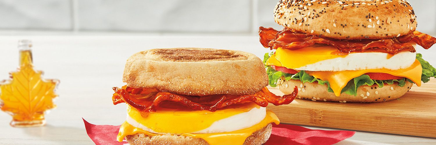 Two classic Canadian flavours come together to create the NEW Tim Hortons Maple Bacon Breakfast Sandwiches, featuring our crispy smoked bacon with a sweet and savoury glaze that's made with 100% Canadian Maple Syrup